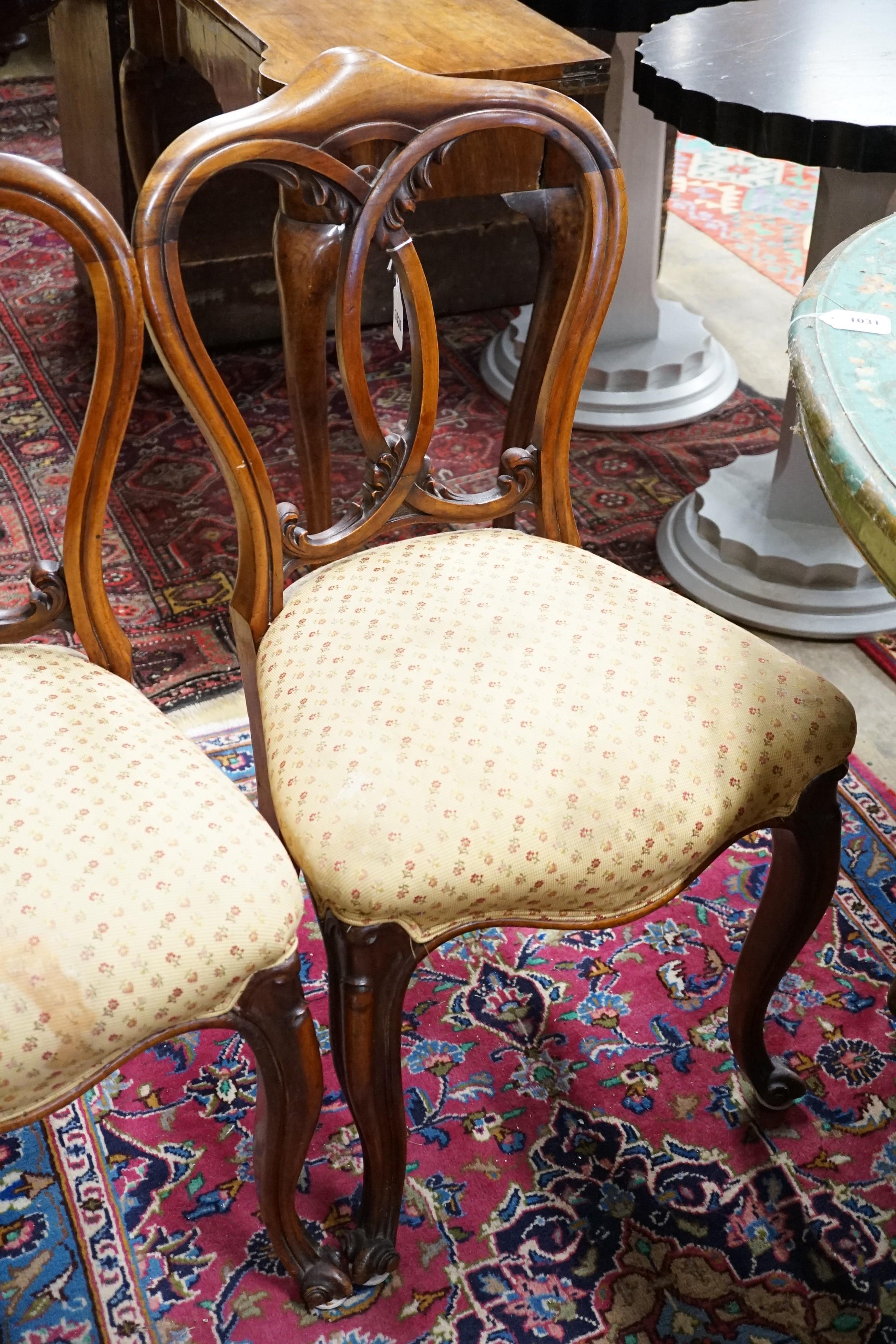 A set of five Victorian mahogany dining chairs with interlaced backs and cabriole legs